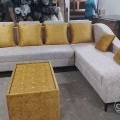 Lounger sofa with pillows and centre table