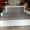 White wooden sofa cum bed