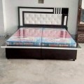 wooden bed without mattress